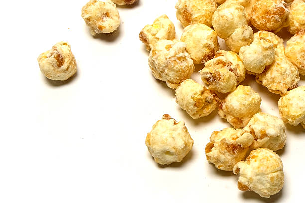 istock close up popcorn with butter flavor, isolated on white background 2254306074