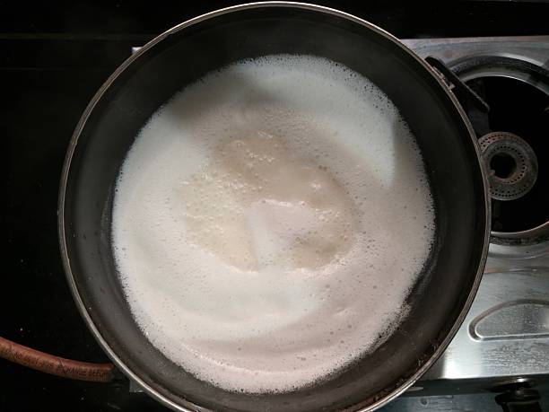 istock Ghee is clarified butter. Boiling yellow butter with small white bubbles 2254309555