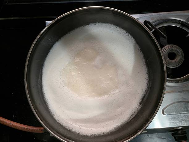 istock Ghee is clarified butter. Boiling yellow butter with small white bubbles 2254309559