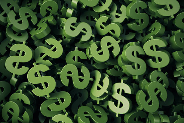 istock Green colored dollar symbol stacks on background 2254312071