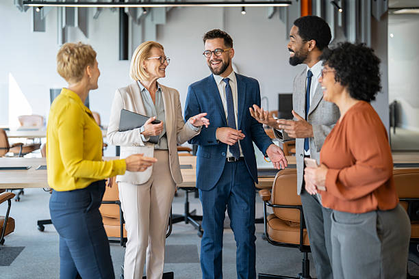 istock Business people having a lively discussion in modern office 2254312277