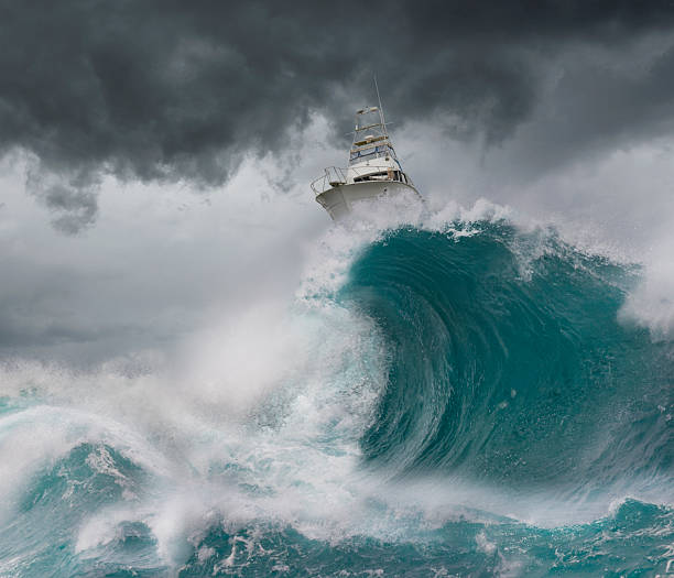 istock Conceptual image of boat riding waves in a storm 2254314303