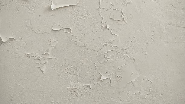 istock The surface or background of an old white wall with peeling paint 2254314799