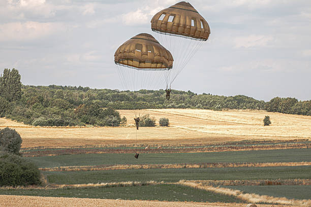 German paratroopers from an elite airborne unit take part in a NATO exercise, equipped with modern gear and weapons, training joint operations, international defense cooperation, and military readiness in the field.