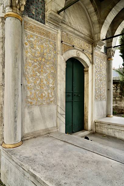 istock Hand-carved gold-painted decoration on marble 2254321247