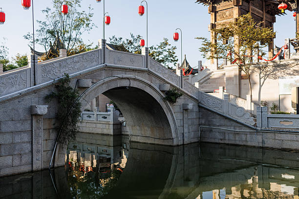 Chinese style stone arch bridge on the river