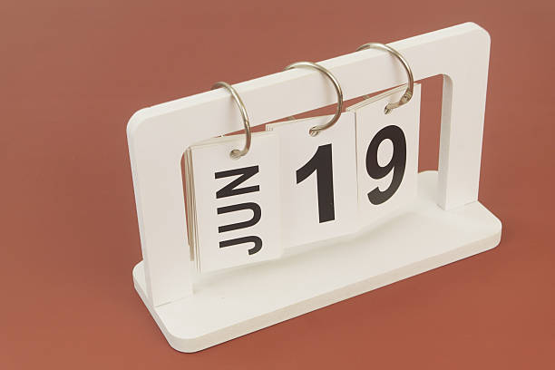 istock June 19 on calendar on brown background 2254322525