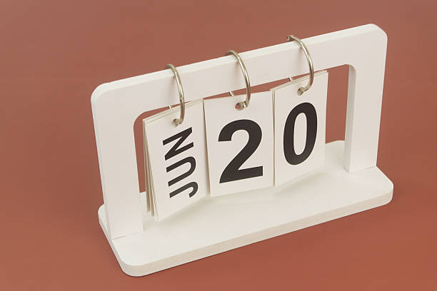 istock June 20 on calendar on brown background 2254322529