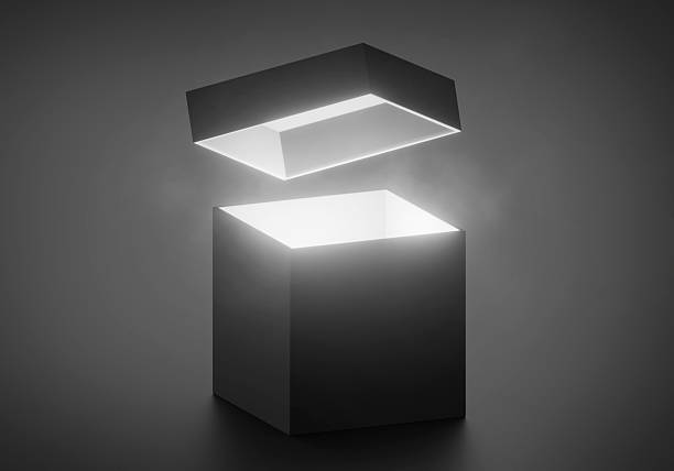 istock Mysterious magical box opening with rays of light, high contrast image 2254322566