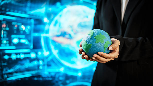 istock Business professional holding small Earth model before futuristic digital interface, global responsibility,environmental awareness,world protection, sustainability, modern international collaboration 2254322830