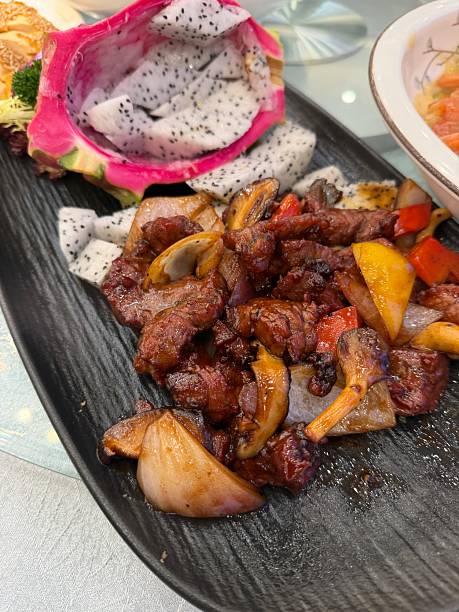 istock Stir-fried beef, shiitake mushrooms and onions 2254323301