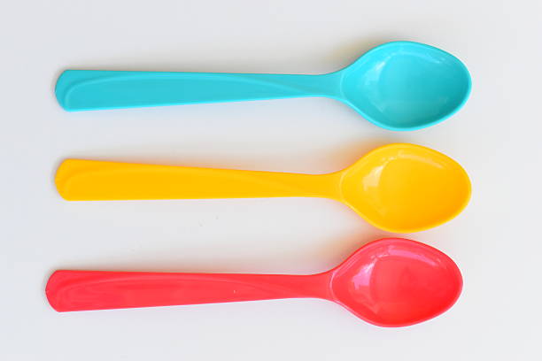 colorful spoon isolated on white background, plastic cutlery for picnic