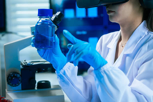istock An Asian female scientist in a modern lab interacts with 3D holographic data using VR/MR headset, integrating microscopy, chemical analysis,computational biotechnology immersive, advanced scientific 2254324235
