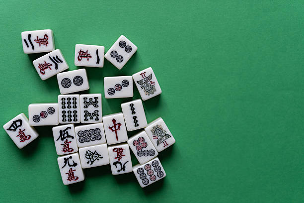 istock Mahjong tiles lined up on a green background 2254325087