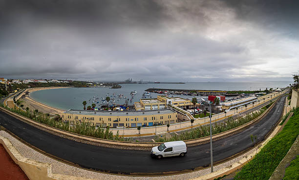 istock Sines Portugal harbor and beach under cloudy sky with van drivin 2254326769