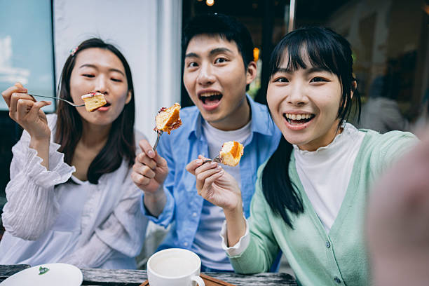 istock A group of young Asians is having a blast outdoors, laughing, chatting, and enjoying various activities together. 2254328283