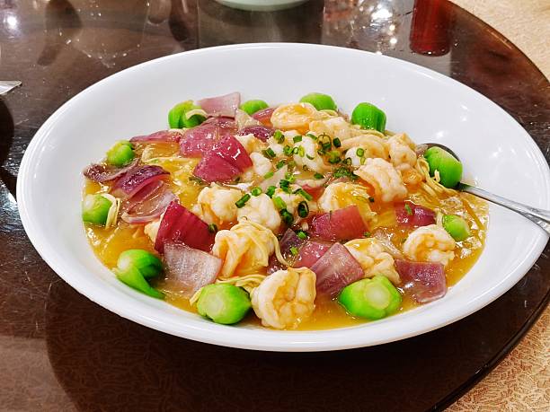Sautéed Prawns and Scallops with Seasonal Vegetables