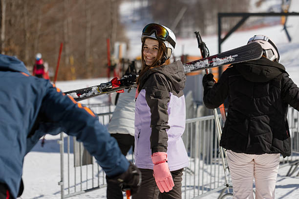 istock Female Skier Smiling at Camera on Snowy Slope 2254332301