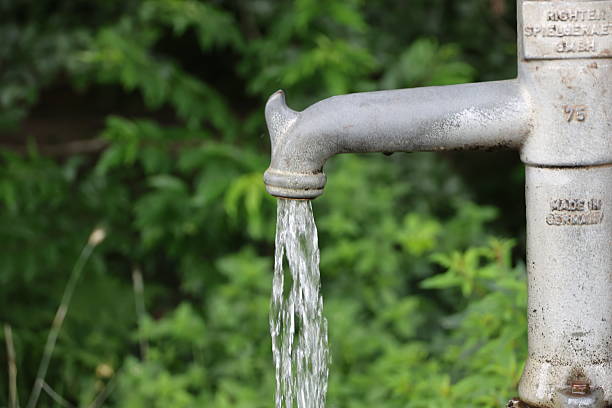 istock Fresh groundwater from the tap pumped from the ground with a hand pump 2254332547