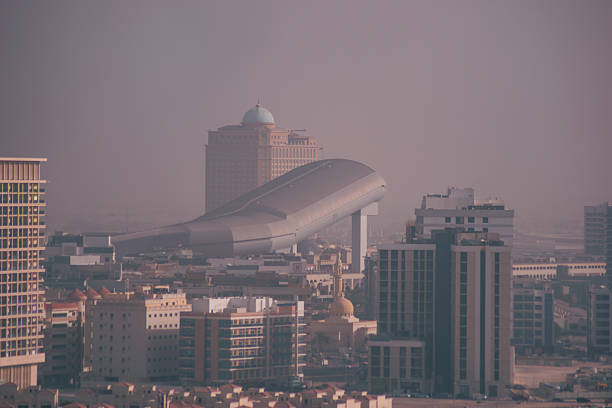 Photograph of the Dubai skyline with the distinctive Ski Dubai indoor snow dome rising above surrounding buildings. Captured from a hotel window, the image showcases the city’s unique architecture, urban development, and desert haze atmosphere. Ideal for themes related to tourism, travel, modern architecture, Middle East destinations, and Dubai cityscapes.