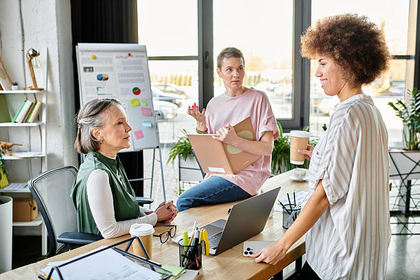 istock Women collaborating in a modern office space during a busy workday 2254334458
