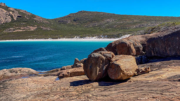 istock Rugged Coastal Landscape Featuring Weathered Boulders and Turquoise Ocean 2254335062
