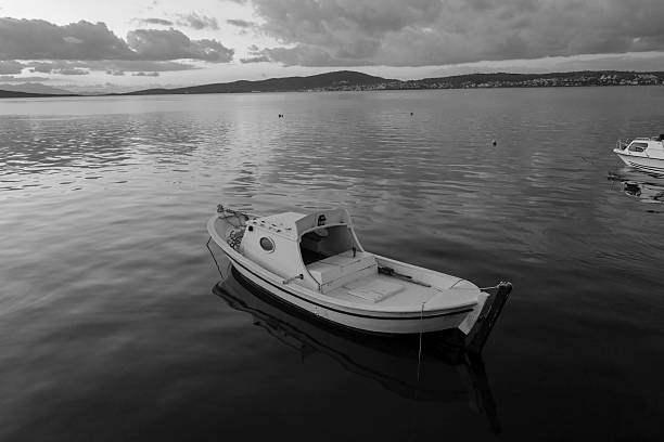 A white boat in harbor at dusk time, Turkey