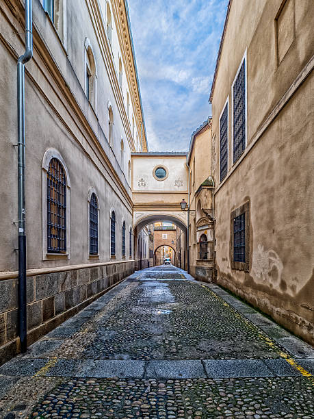 istock Cobblestone street in Plasencia, Spain, with archway 2254336866