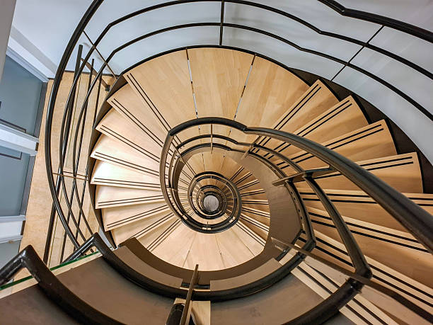 istock Round staircase with wooden steps in building 2254336981