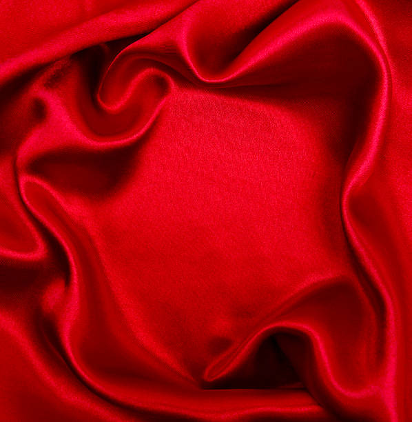 istock Smooth elegant red silk or satin luxury cloth texture as abstract background. Luxurious background design 2254338723