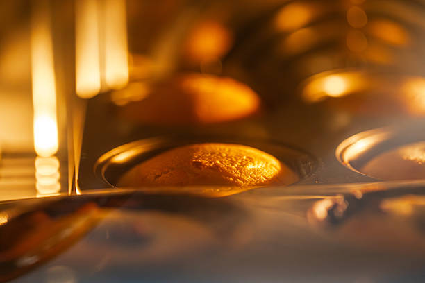 It captures the heartwarming moment of a pound cake gradually rising and browning under the high temperature of the oven.