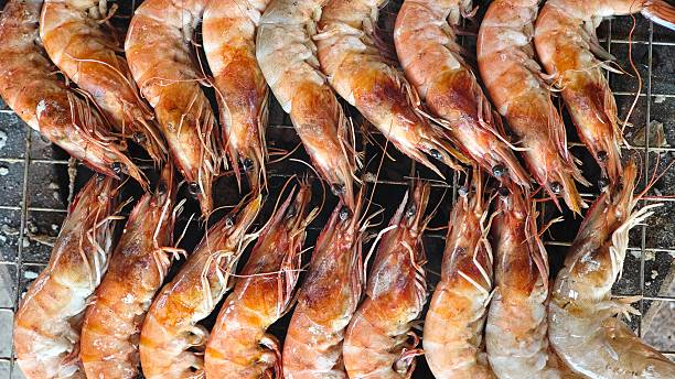 istock Grilled shrimp on charcoal stove. 2254343840