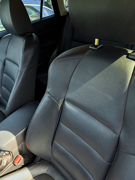 istock Black leather car seats showing texture and design in a modern vehicle during daylight 2254346657