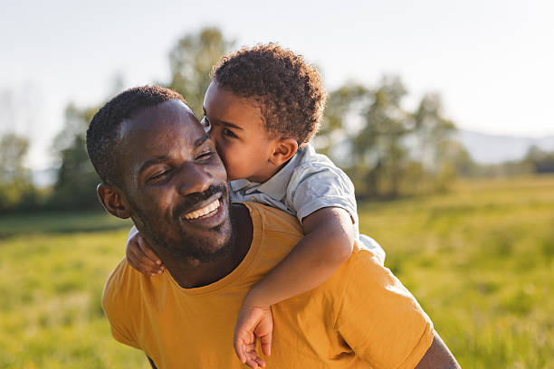 istock Dad and son enjoy the sun 2254346938