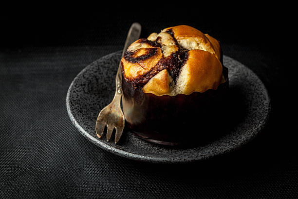 Home made yeast roll with chocolate. Dark light.
