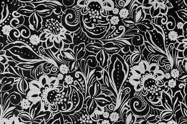 Flower and plant style swirl pattern on material in black and white