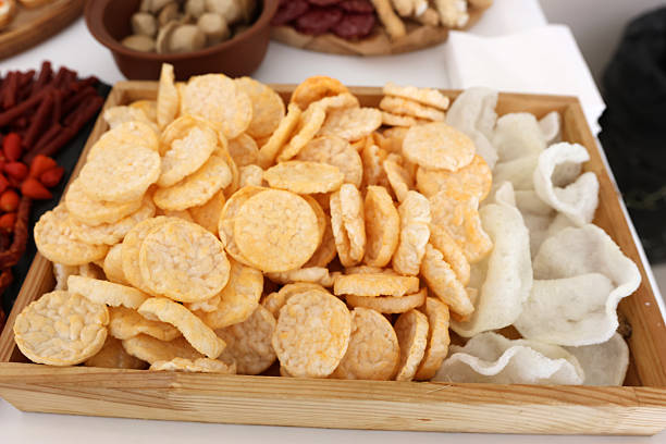Corn and rice snacks served in wooden box for buffet or catering