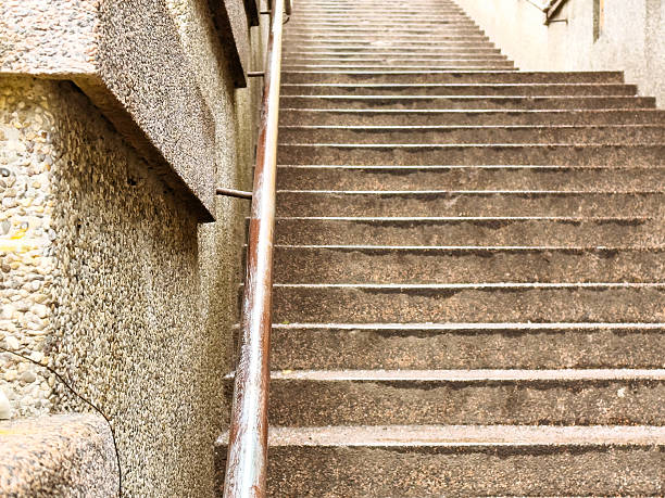 Urban concrete staircase with textured wall