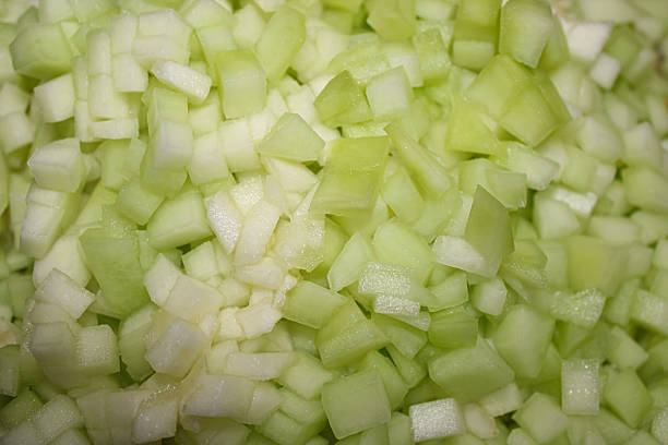 istock Fresh Diced Raw Cucumber Pieces Close Up Background 2254357883