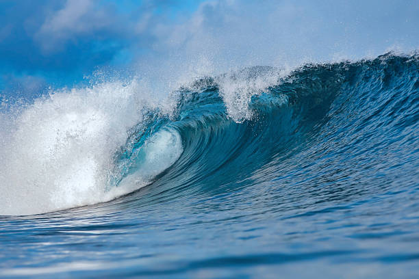 istock Clear Sky And Sharp Sunlight Illuminate Massive Turquoise Coastal Wave In Motion 2254357905