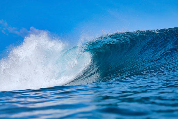 istock Clear Sky And Sharp Sunlight Illuminate Massive Turquoise Coastal Wave In Motion 2254358031