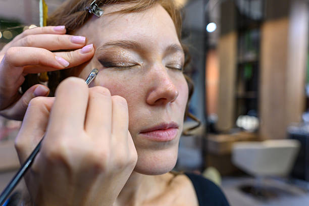 istock Makeup application in a beauty salon showcasing skill and artistry 2254359340