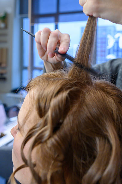 istock Creating beautiful curls in a vibrant salon setting during the afternoon glow 2254359396