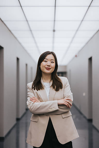istock Confident professional woman in a corridor with modern interior design 2254360043