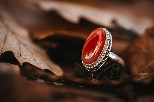 Red coral silver ring in the nature