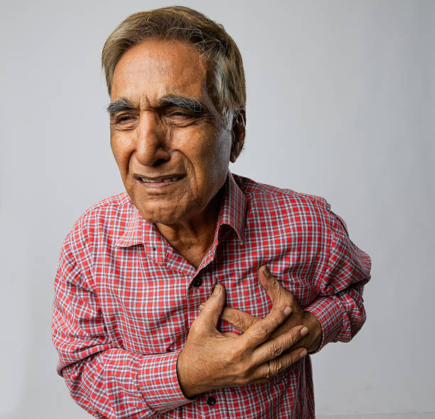 istock Old man suffering from heart attack on white background 2254360364