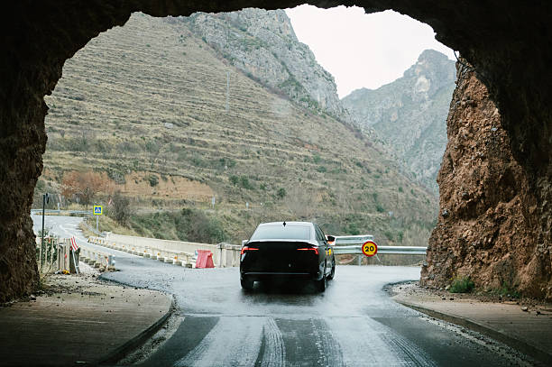 istock Car Passing Through Mountain Tunnel 2254362659