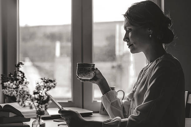istock Woman reading at home 2254364224