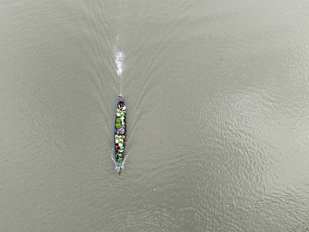 Sadarghat, Dhaka, Bangladesh, 13 June 2024: Arial view of boat full of cattle transporting Through Buriganga River