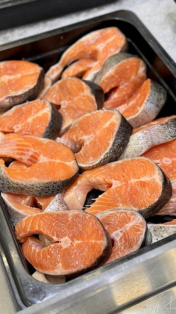 istock Brightly Colored Salmon Slices Beautifully Presented For Customers, Exquisite Salmon Steaks Meticulously Displayed Showcasing Their Freshness And Appealing Marbling Characteristics 2254368534
